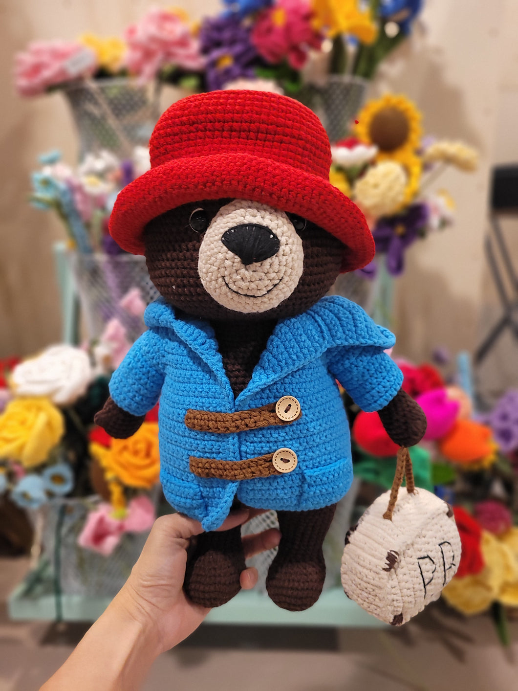 Chubby brown bear with a red hat